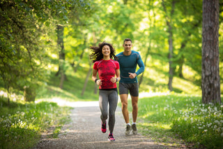 A couple jogging on a beautiful path. The Exercise Toolbox at work!