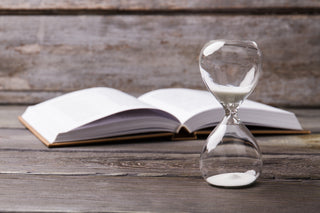 A book and hourglass.